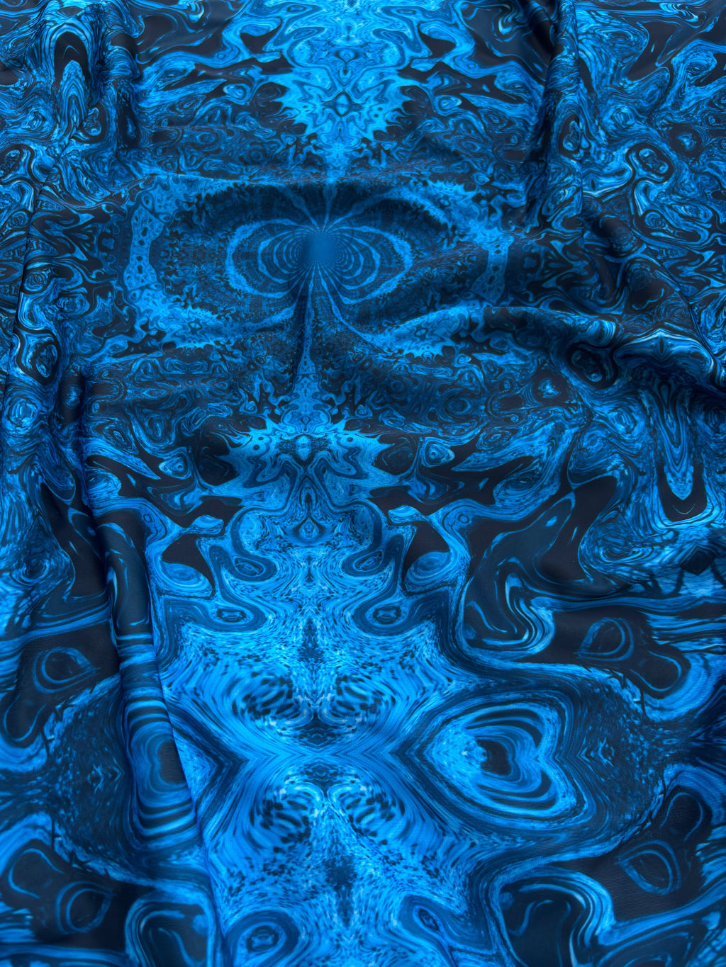 Lycra astratto caleidoscopico blu
