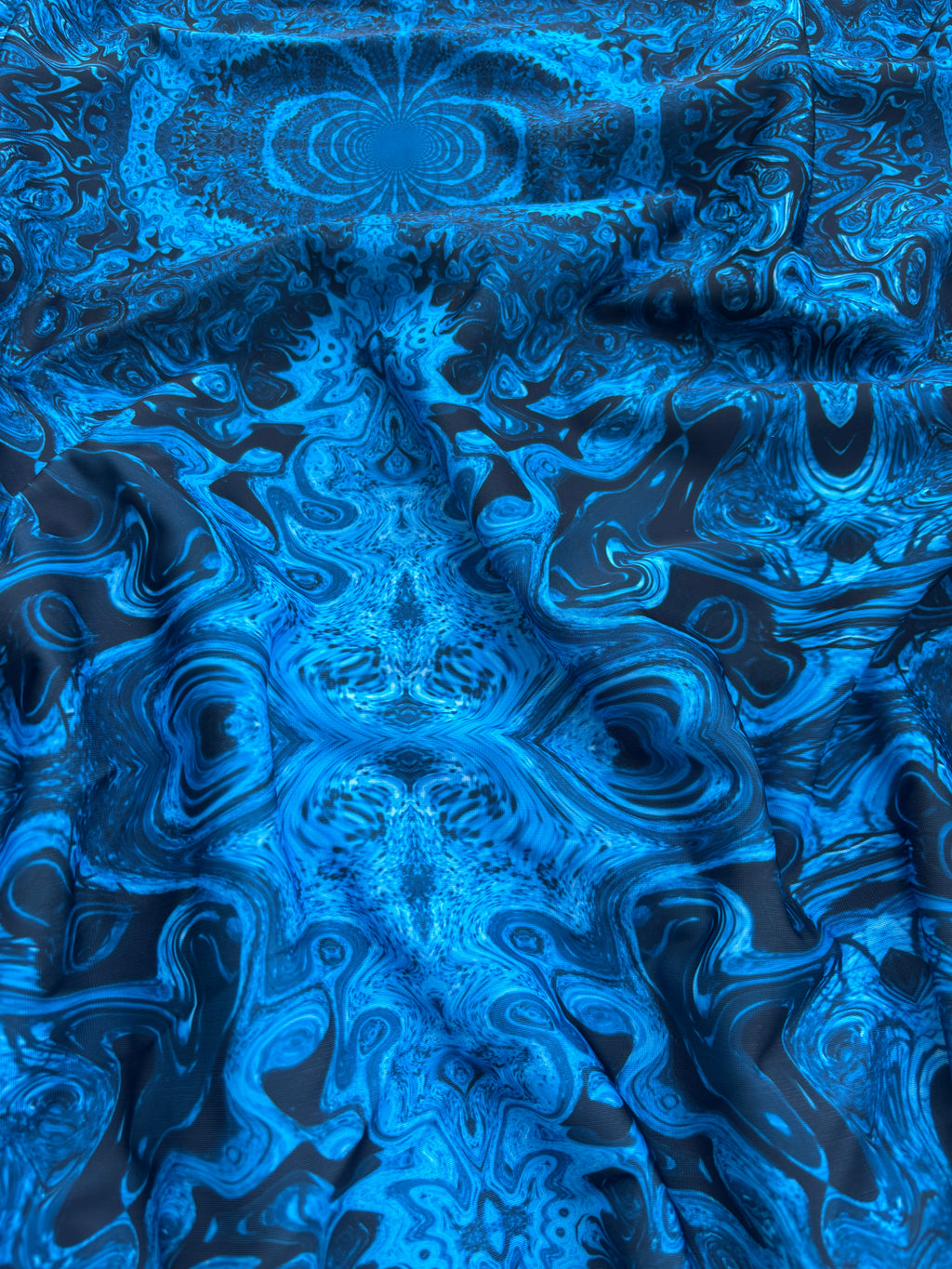 Lycra astratto caleidoscopico blu