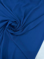 Georgette tinta unita blu royal, tessuto leggero con mano crespa per abbigliamento femminile
