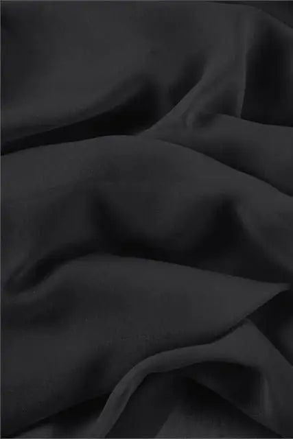 Georgette tinta unita nero, tessuto leggero con mano crespa per abbigliamento femminile