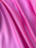 Raso duchesse Vesuvio rosa, tessuto satinato compatto per vestiti eleganti