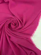 Tessuto georgette tinta unita fucsia, leggero e trasparente, perfetto per abiti eleganti e camicie