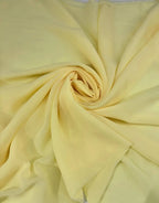 Tessuto georgette tinta unita giallo paglierino, leggero e trasparente, perfetto per abiti eleganti e camicie