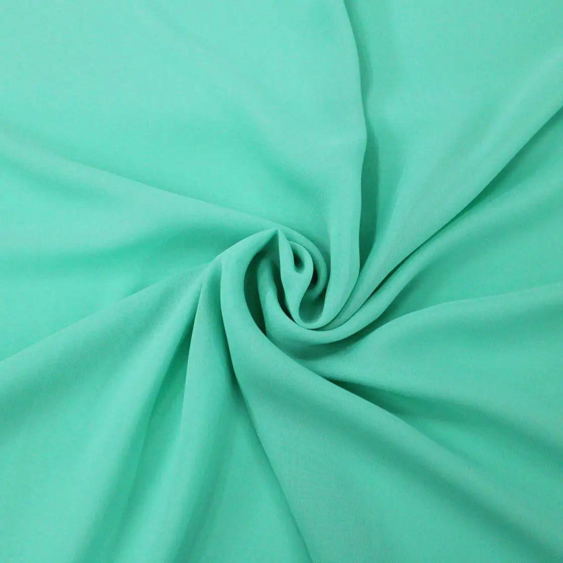 Tessuto georgette tinta unita verde-tiffany, leggero e trasparente, perfetto per abiti eleganti e camicie