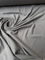 Tessuto jersey cotone elasticizzato grigio medio per leggings e capi aderenti