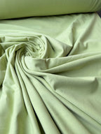 Tessuto jersey cotone verde mela per abbigliamento leggero e quotidiano