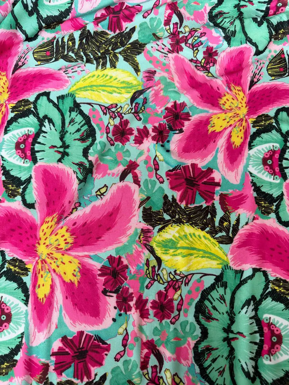 Tessuto jersey floreale esotico colore fondo tiffany, morbido ed elasticizzato, ideale per abiti e maglie leggere