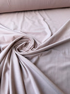 Tessuto jersey cotone elasticizzato color rosa cipria al metro per cucito creativo