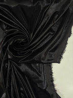 Tessuto lycra milleluci nero, elasticizzato e brillante con effetto glitter, ideale per costumi da danza e spettacolo